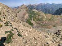 View of Timpanogos Basin with the red American Fork Twin Peaks visible in the upper center of the photo.